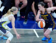 WNBA: Indiana Fever guard Caitlin Clark brings the ball up court against Dallas Wings guard Paige Bueckers at Gainbridge Fieldhouse on July 13, 2025