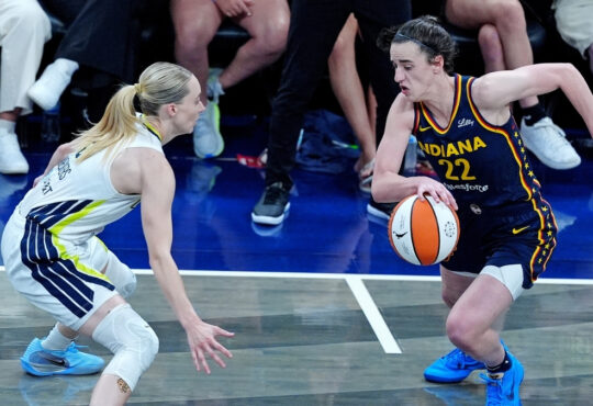 WNBA: Indiana Fever guard Caitlin Clark brings the ball up court against Dallas Wings guard Paige Bueckers at Gainbridge Fieldhouse on July 13, 2025