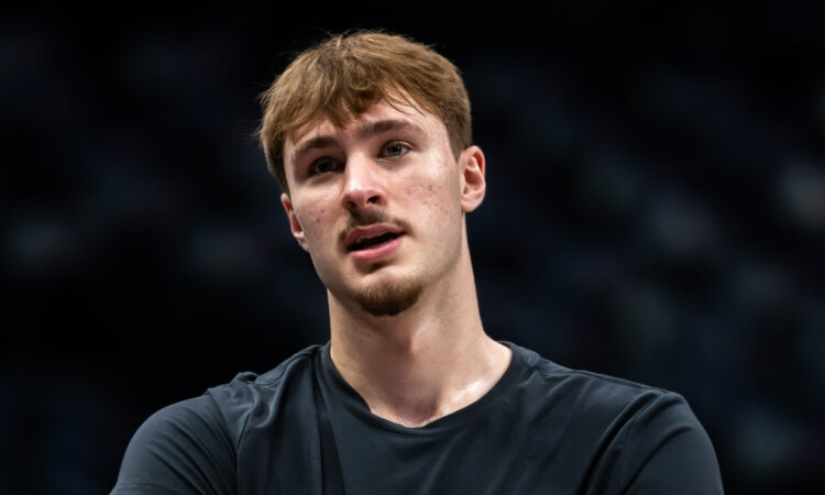 Cooper Flagg warms up during a pregame workout for the Dallas Mavericks before their game against the Denver Nuggets at American Airlines Center.