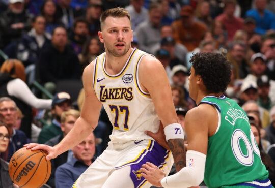 Luka Dončić of the Los Angeles Lakers drives to the basket against Max Christie of the Dallas Mavericks during the first quarter at American Airlines Center on January 24, 2026.