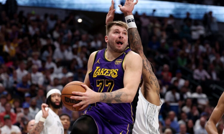 Luka Dončić shoots the ball for the Los Angeles Lakers against the Dallas Mavericks at American Airlines Center