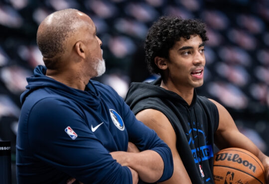 Max Christie talks with assistant coach Phil Handy during a pregame workout at American Airlines Center before Mavericks vs. Nets