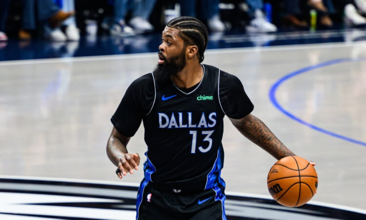 Naji Marshall dribbles the ball at American Airlines Center during a game against the Golden State Warriors