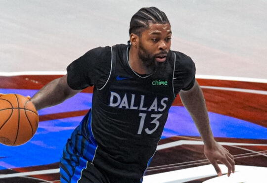 NBA: Naji Marshall drives past Stephen Curry with the ball at American Airlines Center during a game against the Golden State Warriors