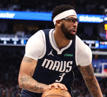 NBA: Anthony Davis controls the ball during the first half at American Airlines Center against the Philadelphia 76ers
