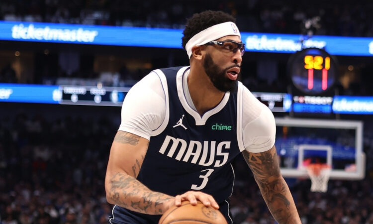 NBA: Anthony Davis controls the ball during the first half at American Airlines Center against the Philadelphia 76ers