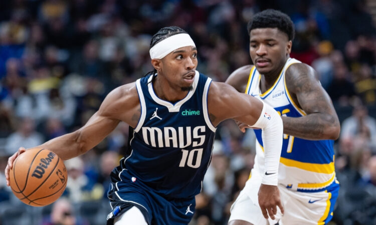 NBA: Brandon Williams dribbles against Kam Jones at Gainbridge Fieldhouse during the Dallas Mavericks' game against the Indiana Pacers.