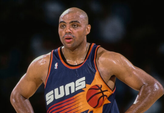 NBA: Charles Barkley looks on with his hands on his hips during a Phoenix Suns game against the Denver Nuggets at McNichols Sports Arena.