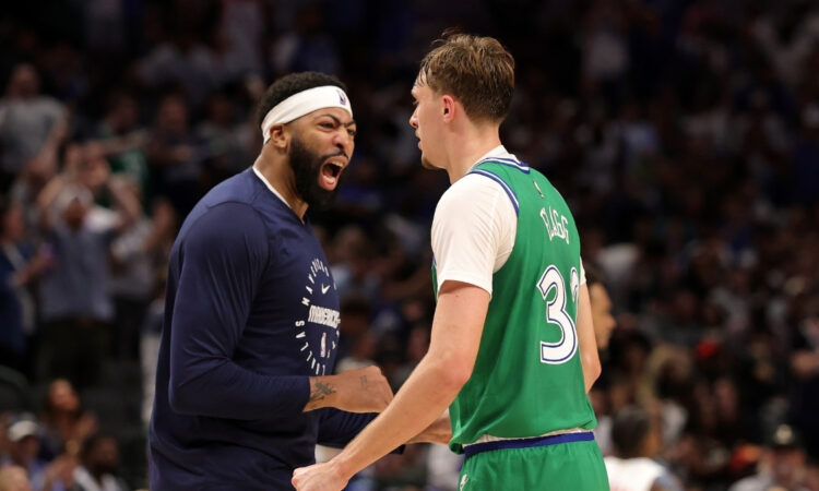 NBA: Cooper Flagg celebrates a score with Anthony Davis during the second half at American Airlines Center against the Toronto Raptors.