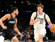 NBA: Cooper Flagg dribbles the ball for the Dallas Mavericks while defended by Devin Booker of the Phoenix Suns at Mortgage Matchup Center.