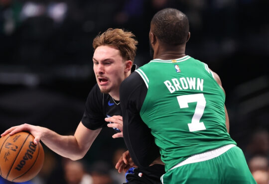 NBA: Cooper Flagg drives to the basket while defended by Jaylen Brown during Mavericks vs Celtics at American Airlines Center.