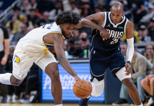 NBA: Khris Middleton of the Dallas Mavericks and Jarace Walker of the Indiana Pacers chase a loose ball during the first half at Gainbridge Fieldhouse against the Indiana Pacers.