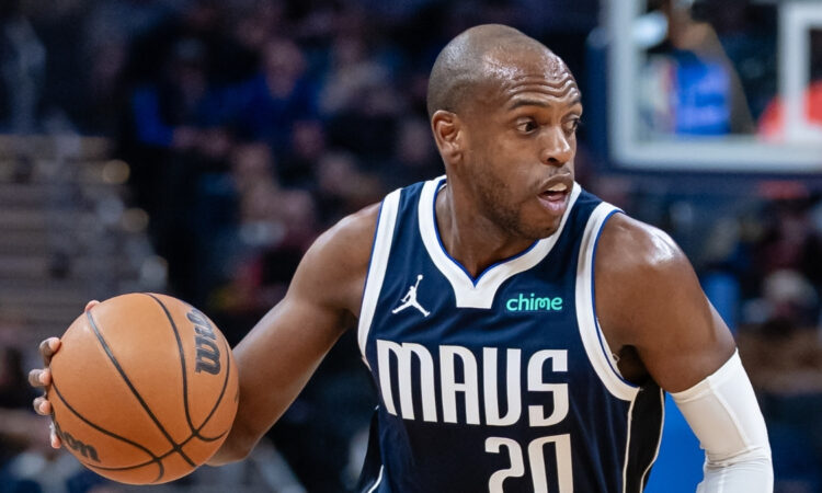 NBA: Khris Middleton dribbles the ball for the Dallas Mavericks during a game against the Indiana Pacers at Gainbridge Fieldhouse.
