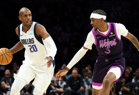 NBA: Khris Middleton dribbles against Jaden McDaniels during the fourth quarter at Target Center as the Dallas Mavericks face the Minnesota Timberwolves.