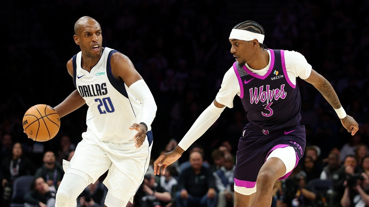 NBA: Khris Middleton dribbles against Jaden McDaniels during the fourth quarter at Target Center as the Dallas Mavericks face the Minnesota Timberwolves.