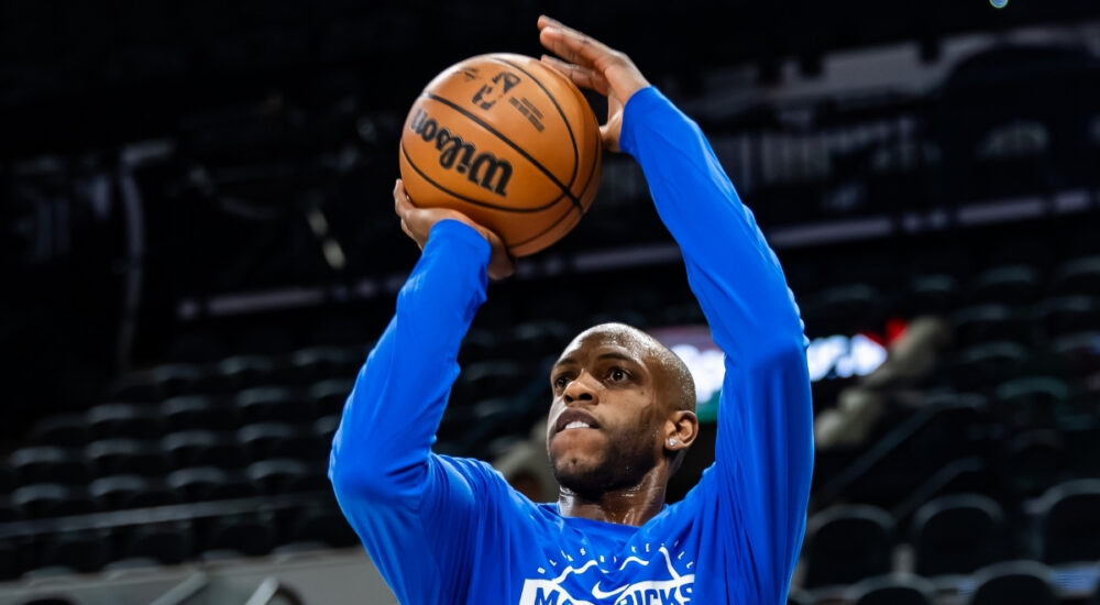 NBA: Khris Middleton takes a jump shot during pregame warmups for the Dallas Mavericks in San Antonio