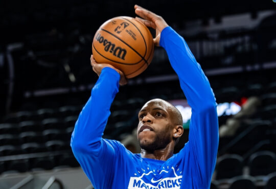 NBA: Khris Middleton takes a jump shot during pregame warmups for the Dallas Mavericks in San Antonio