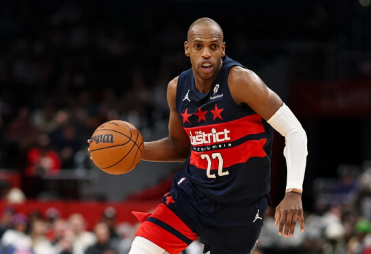 NBA: Khris Middleton brings the ball up court for the Washington Wizards against the Denver Nuggets at Capital One Arena.