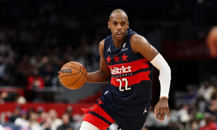 NBA: Khris Middleton brings the ball up court for the Washington Wizards against the Denver Nuggets at Capital One Arena.