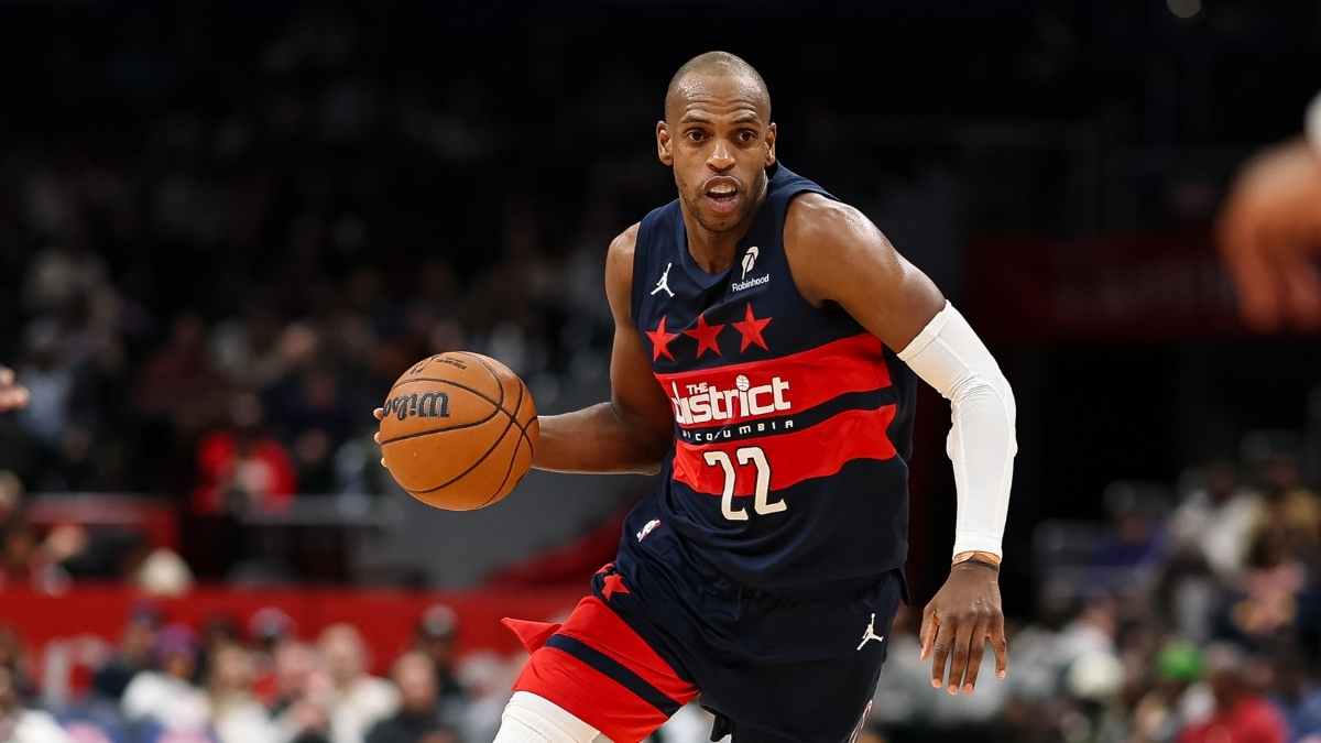 NBA: Khris Middleton brings the ball up court for the Washington Wizards against the Denver Nuggets at Capital One Arena.