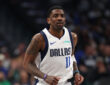 NBA: Kyrie Irving looks on from the court during the first half at American Airlines Center against the Charlotte Hornets