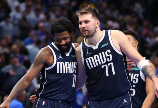 Luka Dončić and Kyrie Irving celebrate for the Dallas Mavericks during an Emirates NBA Cup game against the Memphis Grizzlies at American Airlines Center.