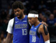 NBA: Naji Marshall and Brandon Williams walk to the bench during the second half of the Dallas Mavericks game against the Sacramento Kings at American Airlines Center.