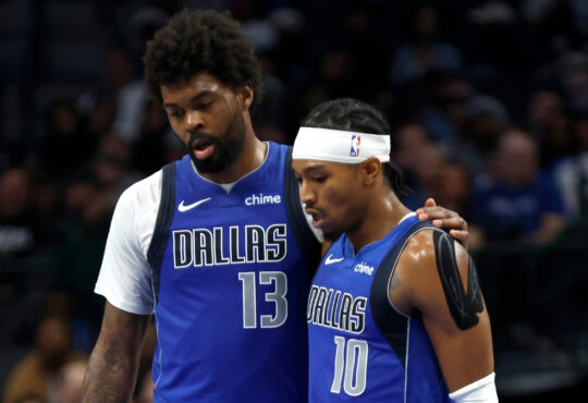 NBA: Naji Marshall and Brandon Williams walk to the bench during the second half of the Dallas Mavericks game against the Sacramento Kings at American Airlines Center.