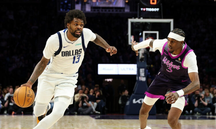 NBA: Naji Marshall of the Dallas Mavericks drives to the basket against the Minnesota Timberwolves at Target Center