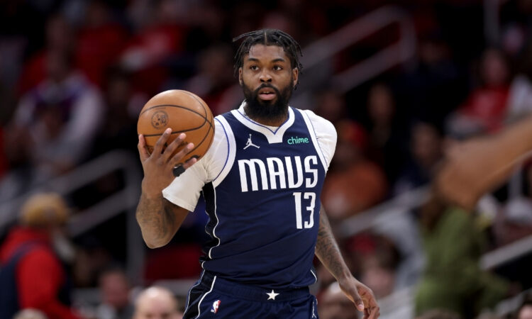 NBA: Naji Marshall brings the ball up court for the Dallas Mavericks against the Houston Rockets at Toyota Center.