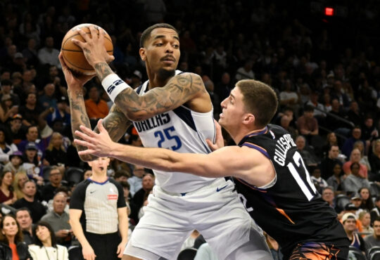 NBA: P.J. Washington looks to pass the ball for the Dallas Mavericks while defended by Collin Gillespie at Mortgage Matchup Center against the Phoenix Suns.
