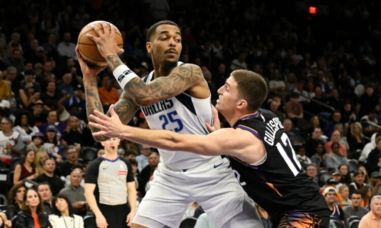 NBA: P.J. Washington looks to pass the ball for the Dallas Mavericks while defended by Collin Gillespie at Mortgage Matchup Center against the Phoenix Suns.