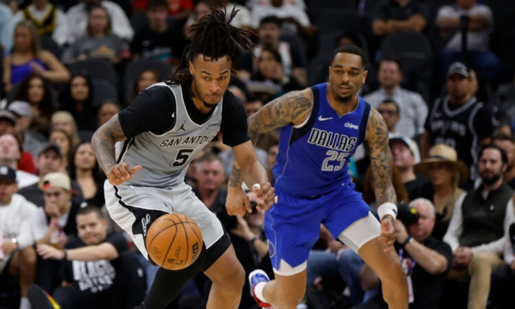 NBA: Stephon Castle makes a steal for the San Antonio Spurs against the Dallas Mavericks at Frost Bank Center