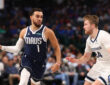 NBA: Tyus Jones drives in the fourth quarter for the Dallas Mavericks while defended by Cam Spencer of the Memphis Grizzlies at American Airlines Center.