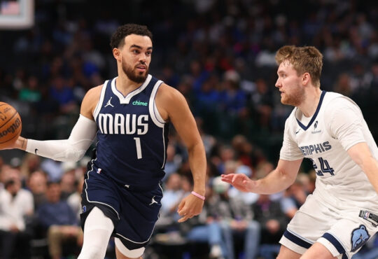 NBA: Tyus Jones drives in the fourth quarter for the Dallas Mavericks while defended by Cam Spencer of the Memphis Grizzlies at American Airlines Center.