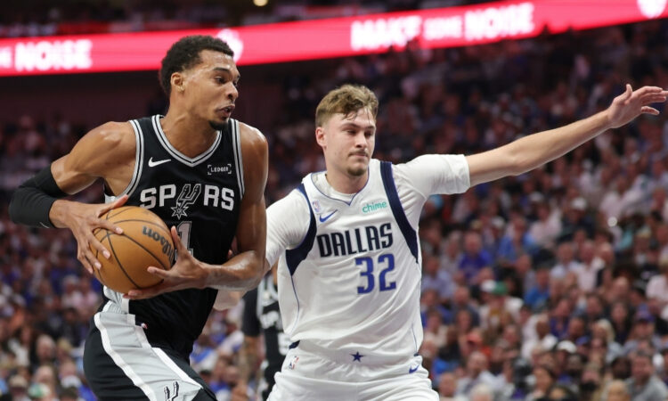 NBA: Victor Wembanyama drives to the basket for the San Antonio Spurs against Cooper Flagg of the Dallas Mavericks at American Airlines Center