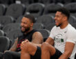 Portland Trail Blazers guard Damian Lillard talks to Milwaukee Bucks forward Giannis Antetokounmpo