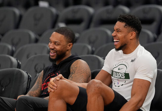 Portland Trail Blazers guard Damian Lillard talks to Milwaukee Bucks forward Giannis Antetokounmpo