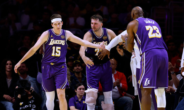 NBA players Luka Dončić, Austin Reaves and LeBron James of the Los Angeles Lakers