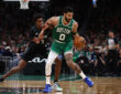 Minnesota Timberwolves forward Jaden McDaniels guards Boston Celtics forward Jayson Tatum