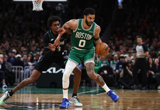 Minnesota Timberwolves forward Jaden McDaniels guards Boston Celtics forward Jayson Tatum