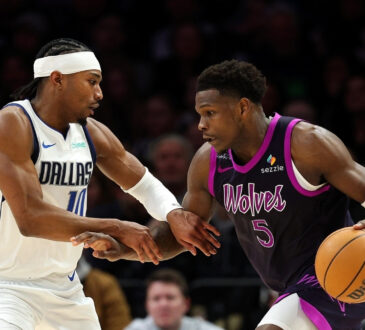 Anthony Edwards (#5) of the Minnesota Timberwolves drives to the basket against Brandon Williams (#10) of the Dallas Mavericks during a game at Target Center in February 2026.