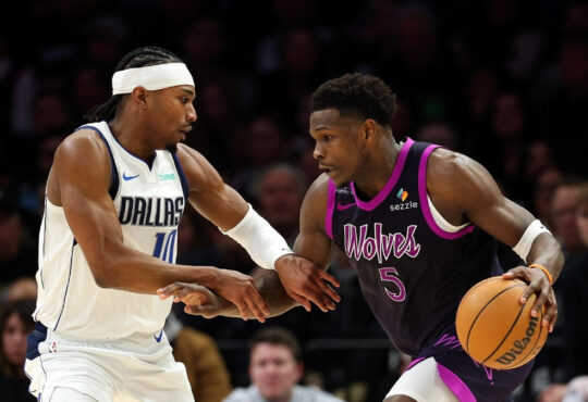 Anthony Edwards (#5) of the Minnesota Timberwolves drives to the basket against Brandon Williams (#10) of the Dallas Mavericks during a game at Target Center in February 2026.