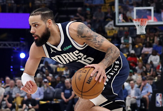 Caleb Martin handles the ball during the Mavericks’ Play‑In Tournament game against the Grizzlies on April 18, 2025.