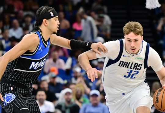 Cooper Flagg #32 of the Dallas Mavericks goes to the basket against Anthony Black #0 of the Orlando Magic at Kia Center on March 5, 2026 in Orlando, Florida.