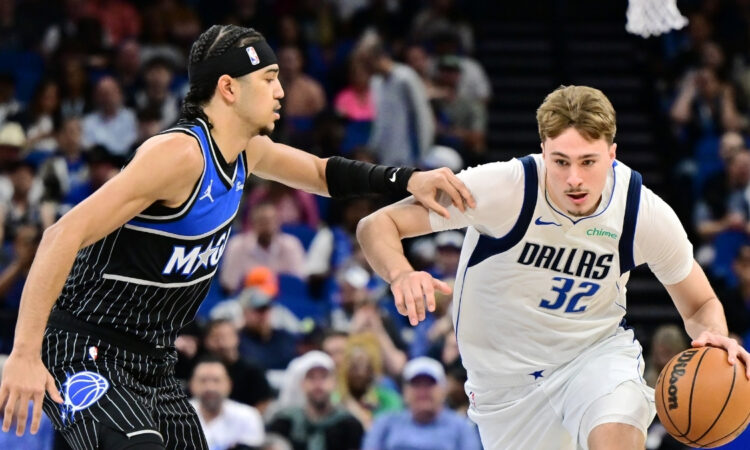 Cooper Flagg #32 of the Dallas Mavericks goes to the basket against Anthony Black #0 of the Orlando Magic at Kia Center on March 5, 2026 in Orlando, Florida.