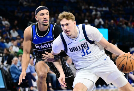 Cooper Flagg #32 of the Dallas Mavericks drives to the basket against Jalen Suggs #4 of the Orlando Magic at Kia Center on March 5, 2026 in Orlando, Florida.