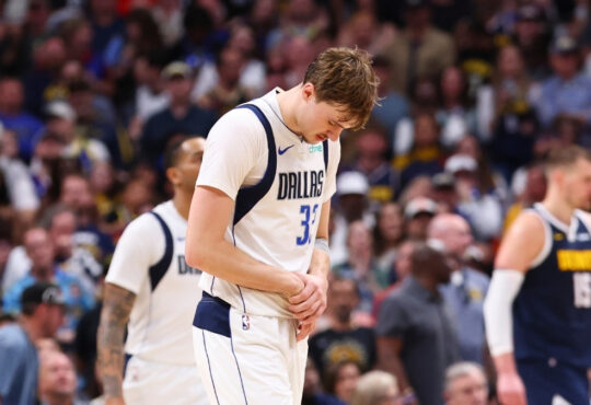 Dallas Mavericks forward Cooper Flagg reacts after suffering a right hand injury in the fourth quarter against the Denver Nuggets on March 25, 2026 in Denver.