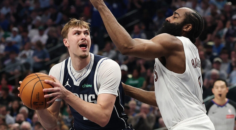 Cooper Flagg #32 of the Dallas Mavericks is defended by James Harden #1 of the Cleveland Cavaliers during the first half at American Airlines Center on March 13, 2026 in Dallas, Texas.