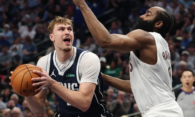 Cooper Flagg #32 of the Dallas Mavericks is defended by James Harden #1 of the Cleveland Cavaliers during the first half at American Airlines Center on March 13, 2026 in Dallas, Texas.